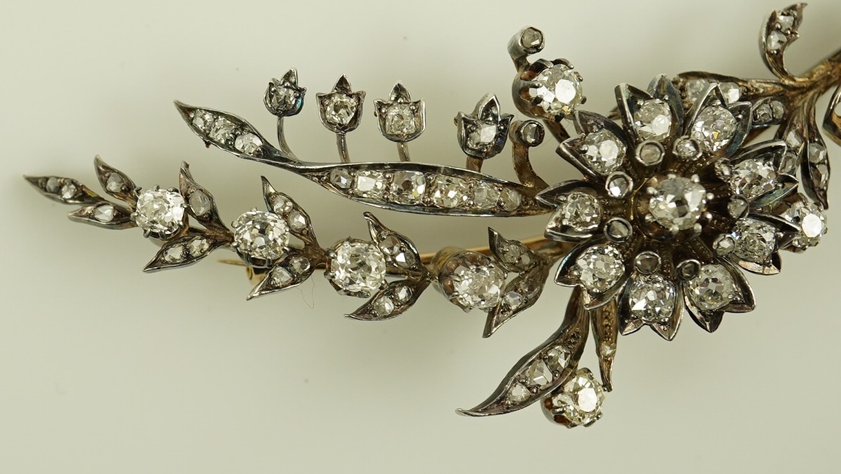 A Victorian gold, silver and diamond cluster foliate spray brooch